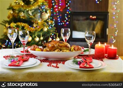 dinner with chicken near Christmas tree