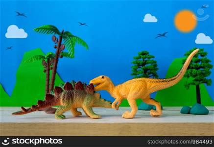 Dinosaur fight scene on wild models background