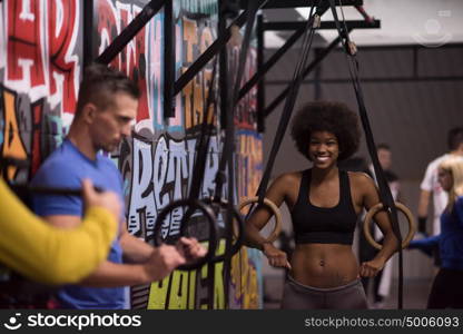 dip ring young man and african american woman relaxed after workout at gym dipping exercise