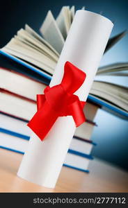 Diploma and stack of books against the background