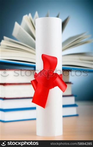 Diploma and stack of books against the background