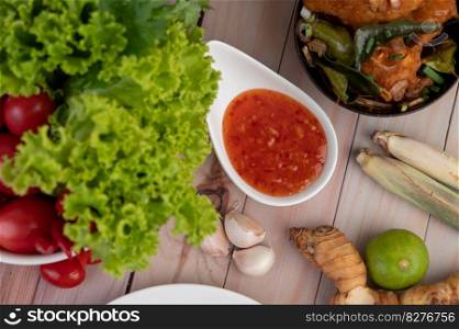 Dipping, Lemongrass, Garlic, Lime, Galangal, Tomato and salad on the wood floor
