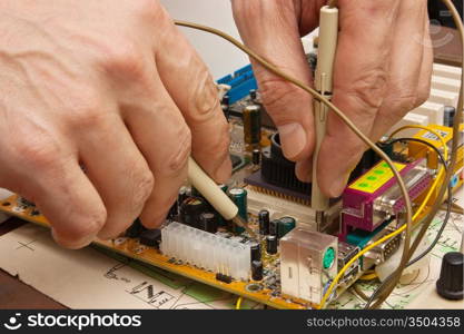 dipstick in hand and electronic board
