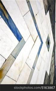 direction sanpietrini busto arsizio street lombardy italy varese abstract pavement of a curch and marble