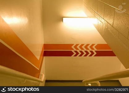 Directional signage in parkade stairway.