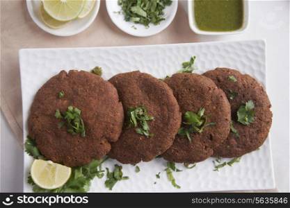 Directly above shot of cutlets arranged in plate