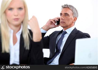 Director receiving phone call on white background