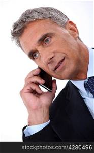 Director talking on phone on white background