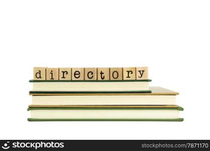 directory word on wood stamps stack on books, library and information concept