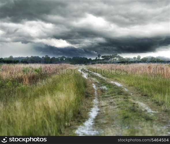Dirt Country Road And Stormy Weather