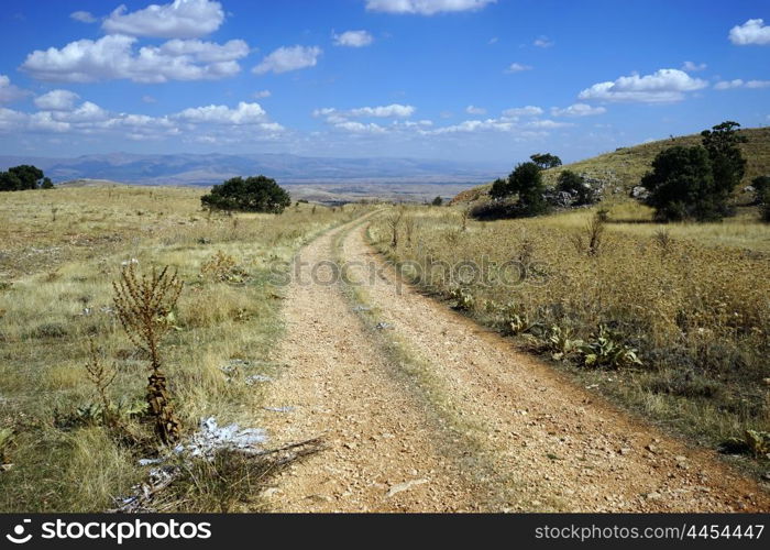 Dirt road and clouds in Turkey