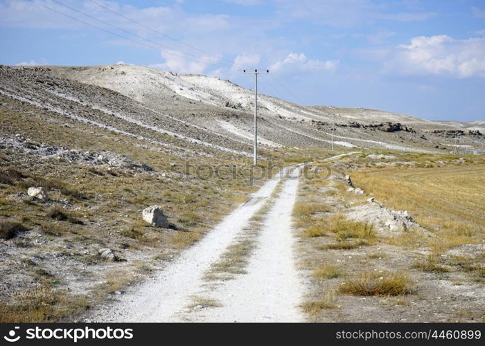 Dirt road and limestone mountain, Turkey