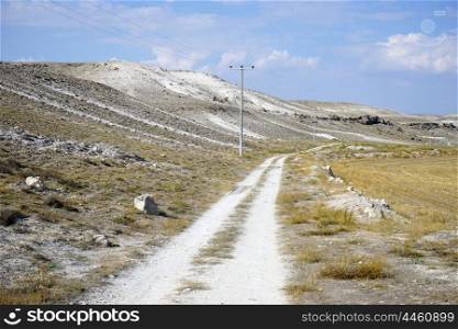 Dirt road and limestone mountain, Turkey