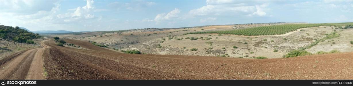 Dirt road and plowed land in Galilee, Israel