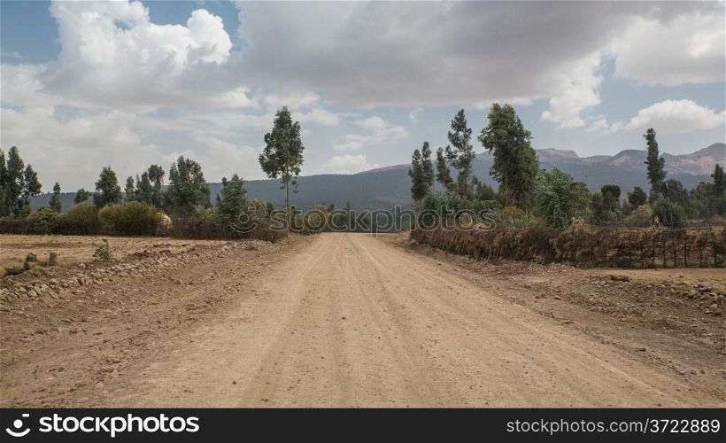 Dirt road crossing the beautiful semi-arid lands of Suba area, Ethiopia