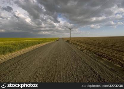 Dirt Road On A Cloudy Plain