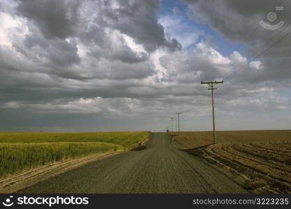 Dirt Road On A Cloudy Plain