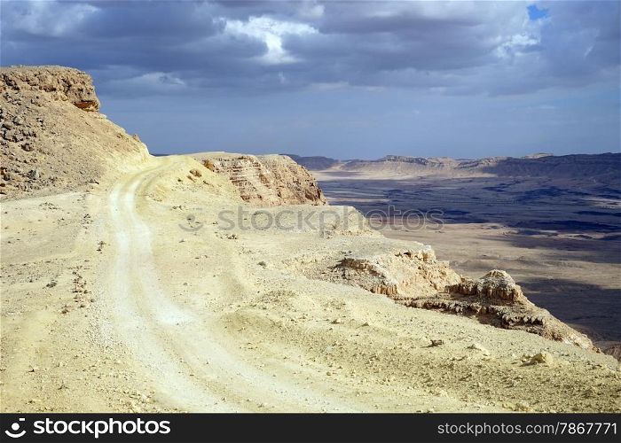 Dirt road on the edge of crater Ramon, Israel