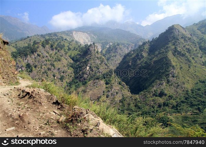 Dirt road on the slope of mount in mountain in Nepal