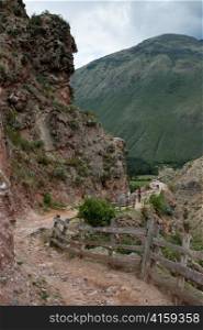 Dirt road passing by a mountain, Sacred Valley, Cusco Region, Peru