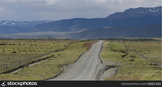 Dirt road passing through a landscape, Torres Del Paine National Park, Patagonia, Chile