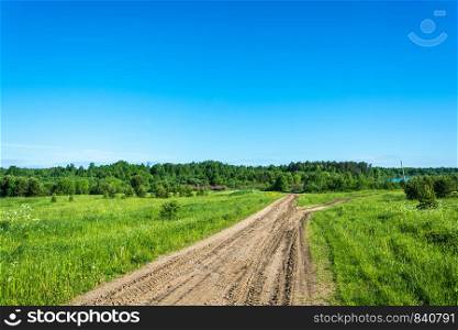 Dirt road to cross the river Vetluga on a summer day, Kostroma oblast, Russia.