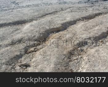 Dirt road with deep tracks and furrows, damaged by torrential rains, Majorca, Balearic islands, Spain.