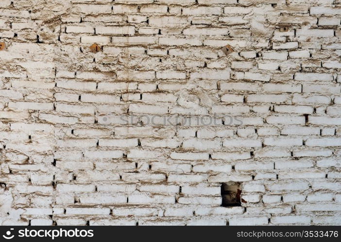 Dirty and weathered white brick wall background texture.