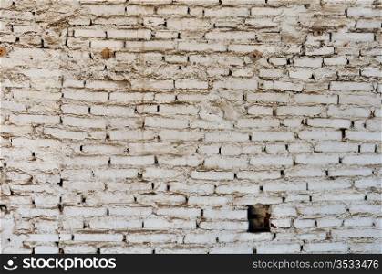 Dirty and weathered white brick wall background texture.