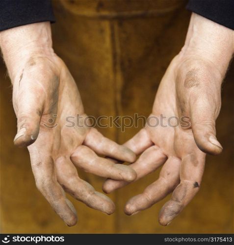 Dirty caucasian male metalmith&acute;s hands.