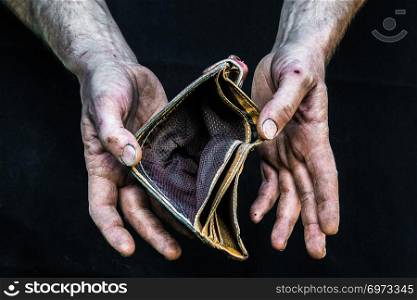 Dirty hands homeless poor man with empty wallet in modern capitalism society