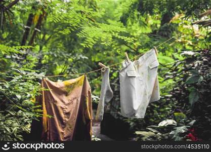 Dirty laundry on a wire in a jungle