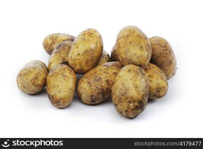 Dirty potatoes isolated on white with natural shadows