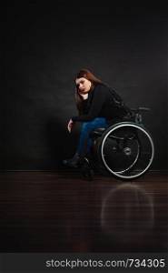 Disability sadness disease tragedy concept. Sad girl on wheelchair. Crippled young gorgeous lady casually dressed sitting on mobile chair.. Sad girl on wheelchair.