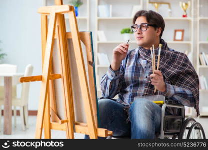 Disabled artist painting picture in studio