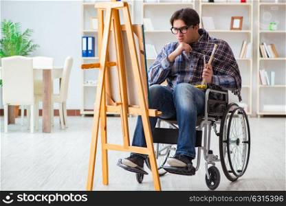 Disabled artist painting picture in studio
