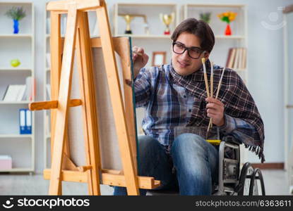 Disabled artist painting picture in studio