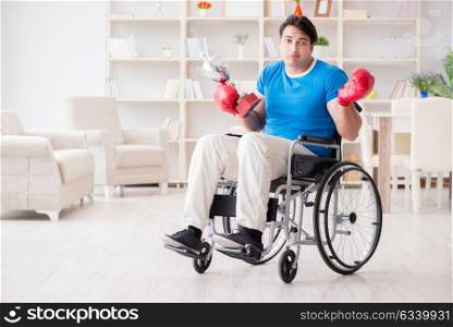 Disabled boxer at wheelchair recovering from injury
