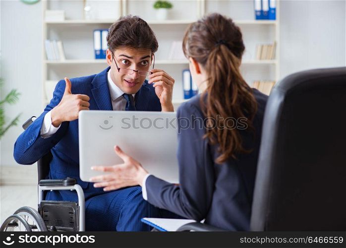 Disabled businessman having discussion with female colleague
