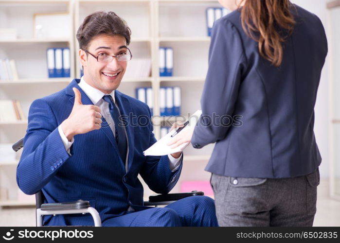 Disabled businessman having discussion with female colleague