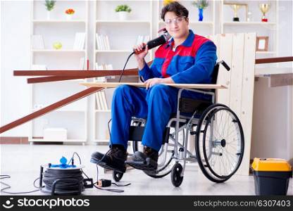 Disabled carpenter working with tools in workshop