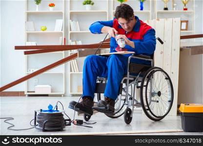 Disabled carpenter working with tools in workshop
