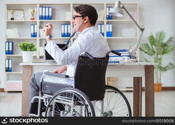 Disabled doctor on wheelchair working in hospital
