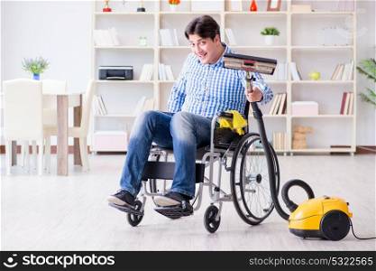 Disabled man cleaning home with vacuum cleaner