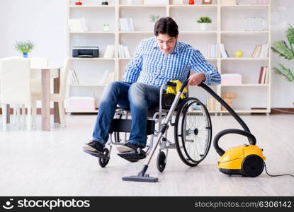 Disabled man cleaning home with vacuum cleaner