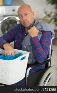 disabled man doing laundry