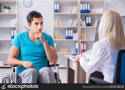 Disabled man in wheel chair visiting woman doctor