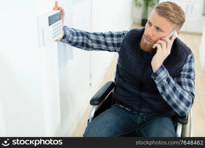 disabled man in wheelchair on the phone