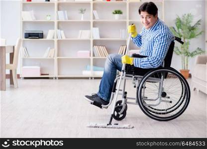 Disabled man on wheelchair cleaning home