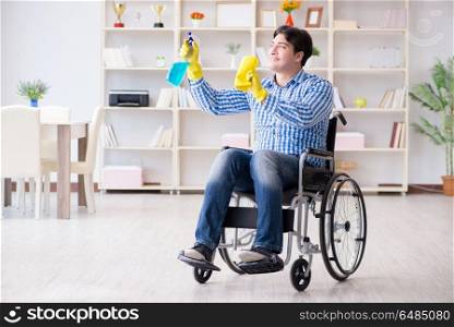 Disabled man on wheelchair cleaning home